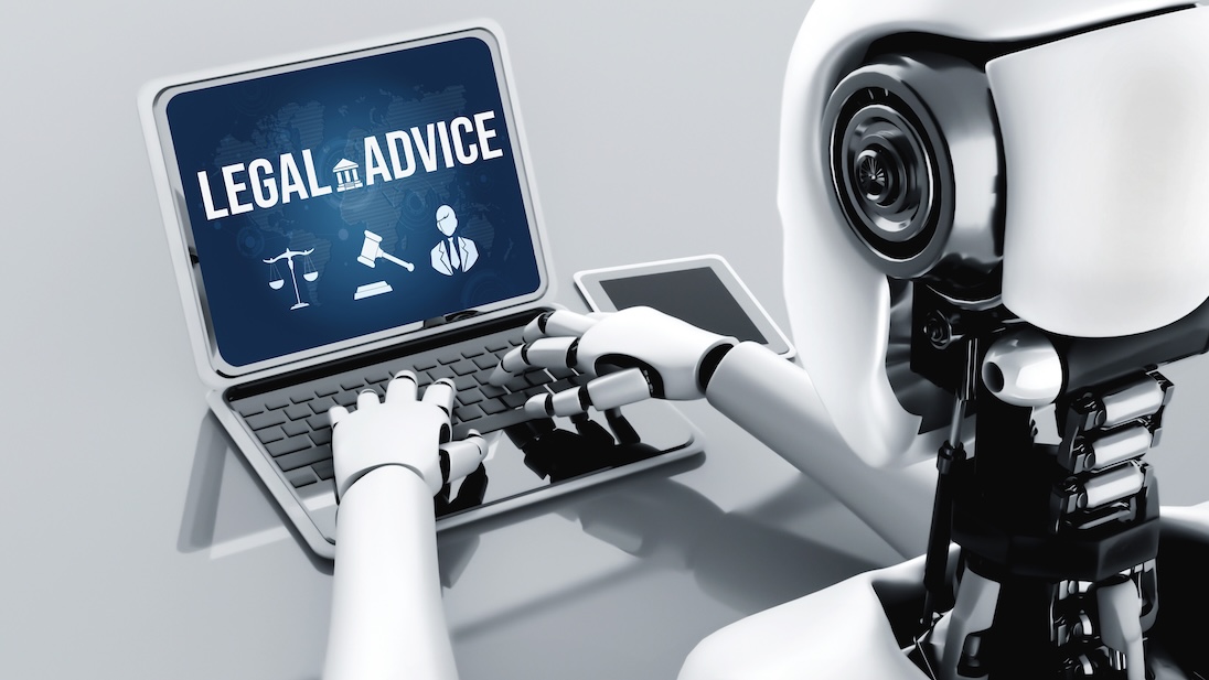 Robot werkt op laptop. op scherm LEGAL ADVICE